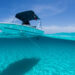 5 signs it's time to replace your boat speakers - a boat floats on turquoise waters